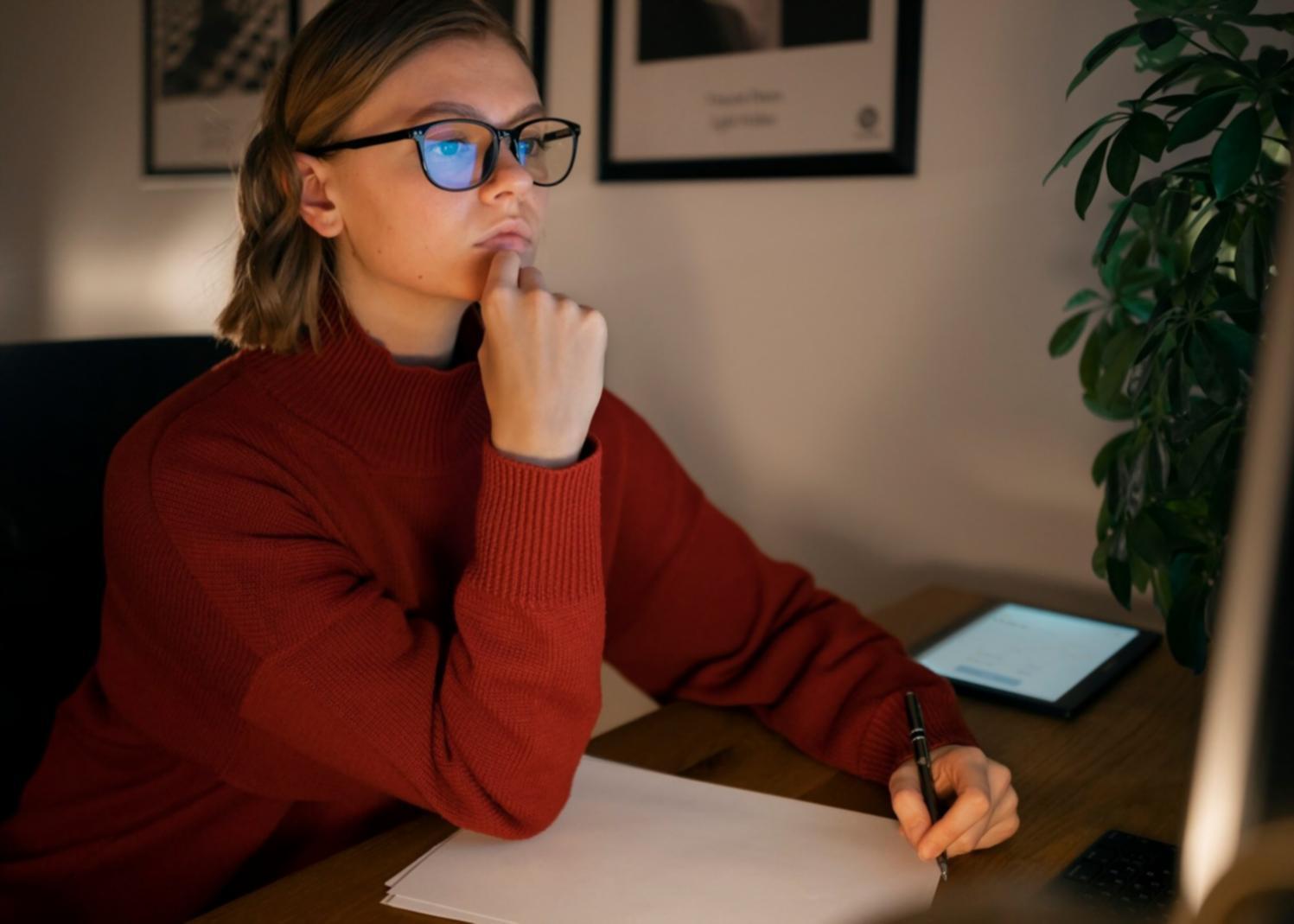 Hands working with financial planning tools and documents