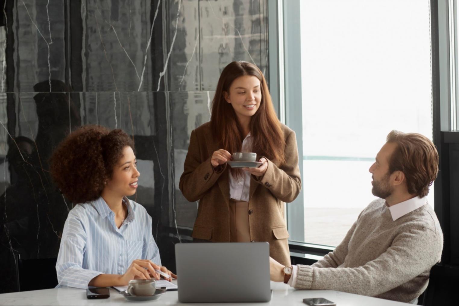 Team collaboration workspace showing financial planning materials and supportive discussion environment